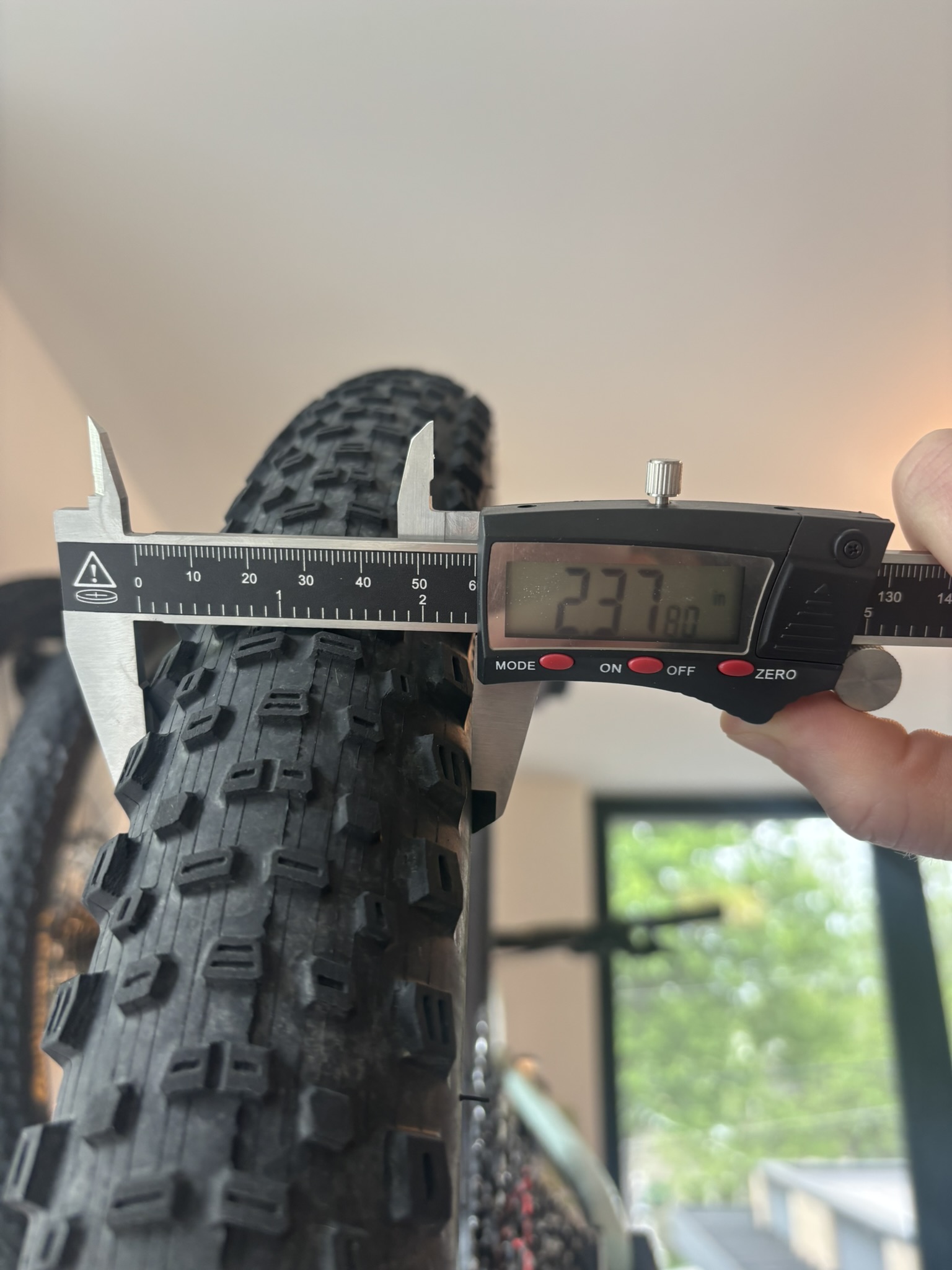 Caliper measuring mounted width of the Kenda Dagger tire