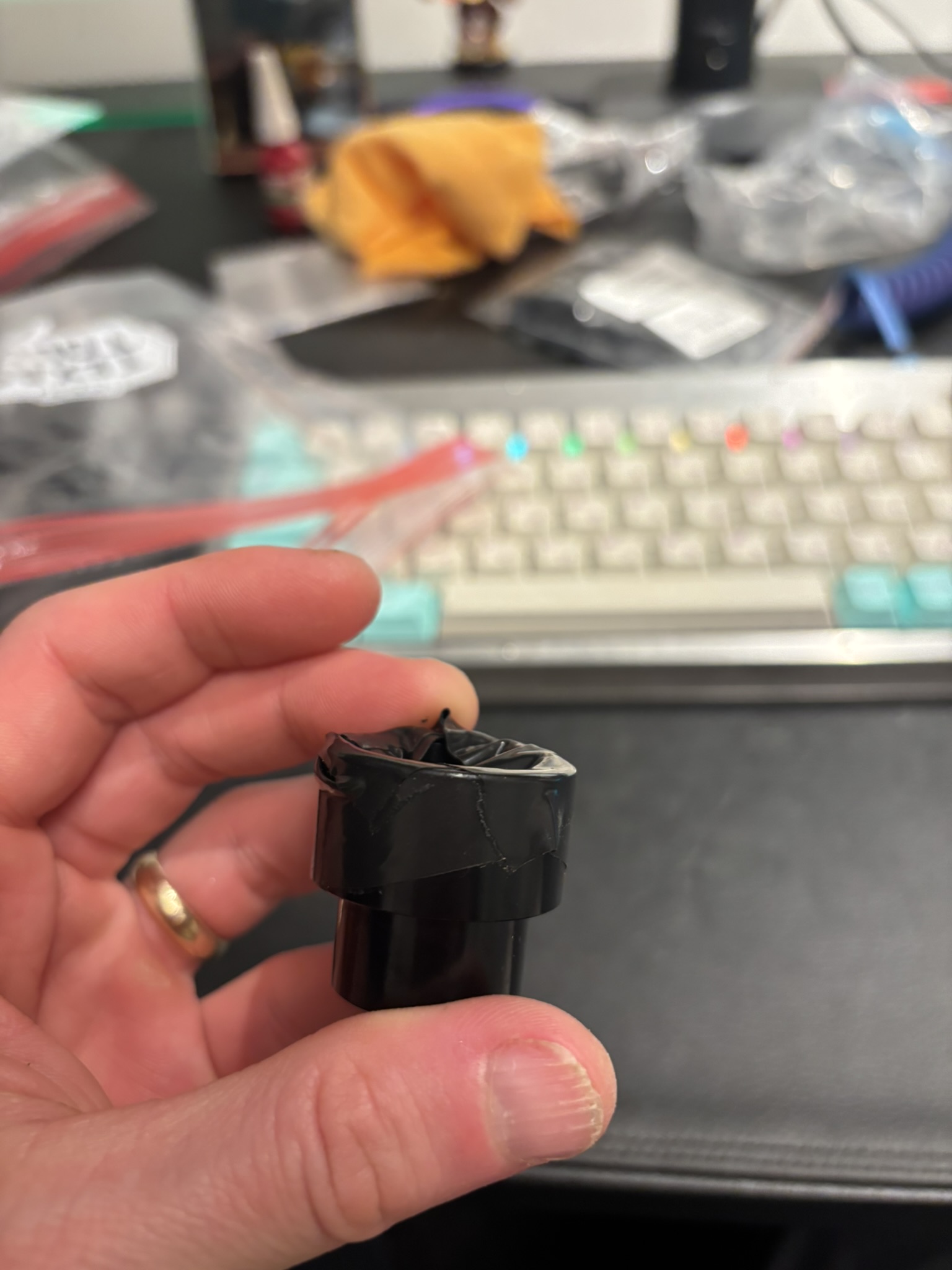 Electrical tape on extractor cup to protect paint around main pivot bearing bores