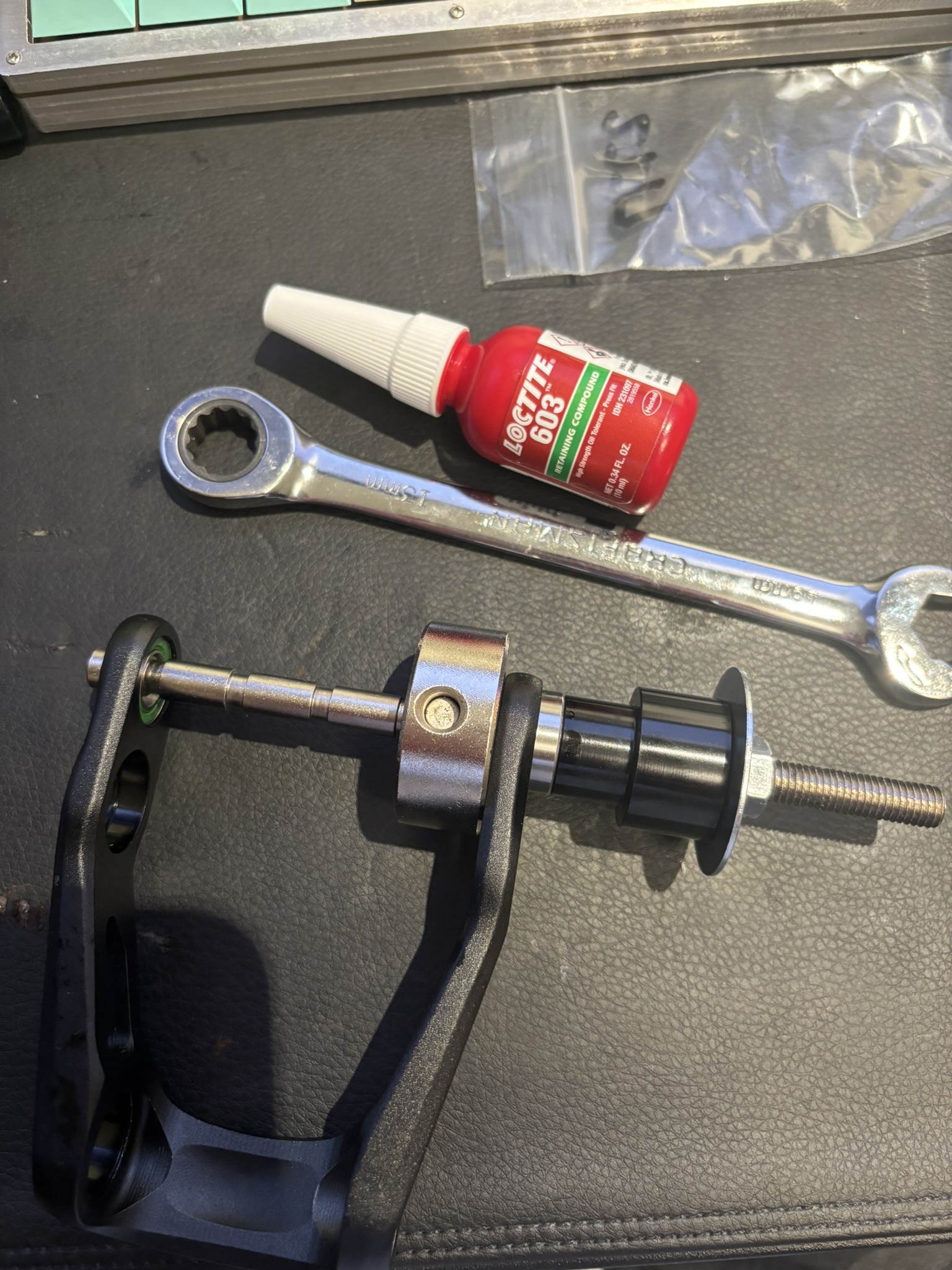 Front bearing staged for pressing into aluminum pivot piece