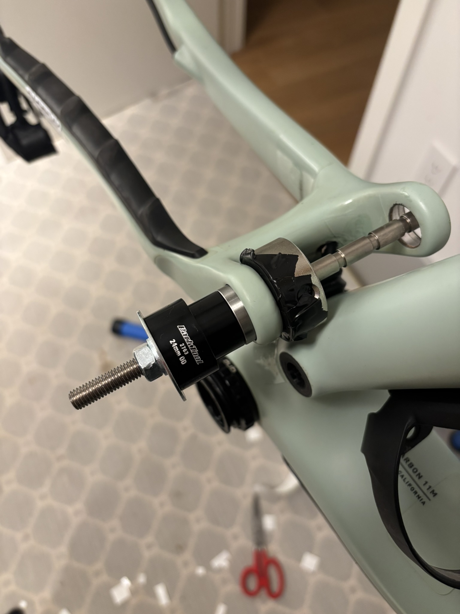 Main pivot bearing staged for pressing