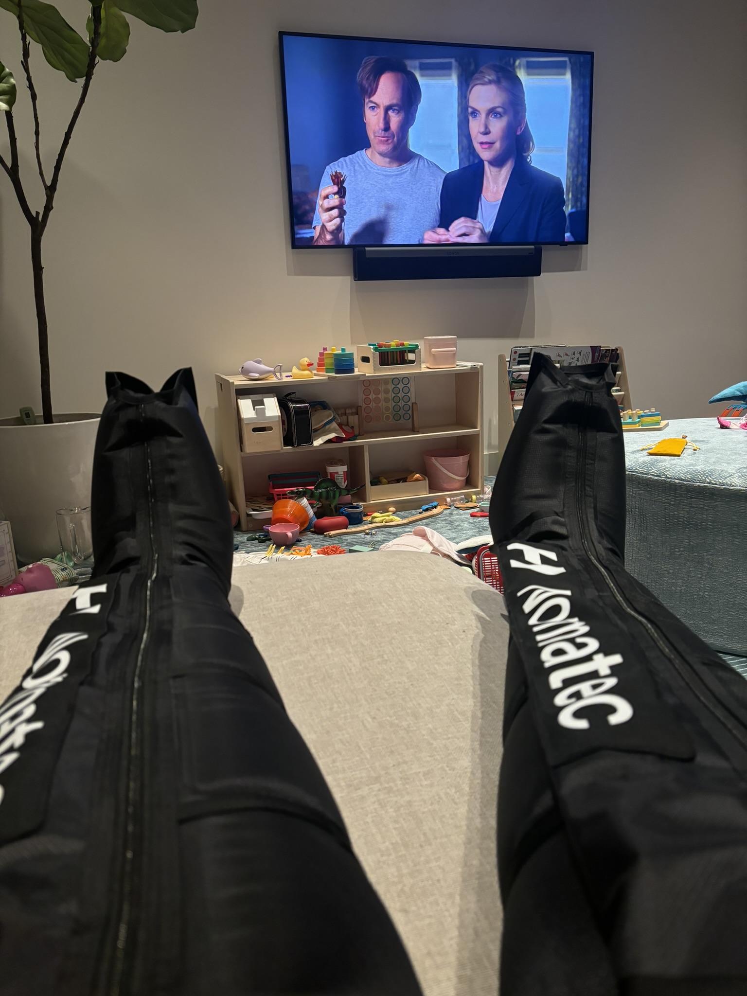 Using Normatecs on the couch watching Better Call Saul