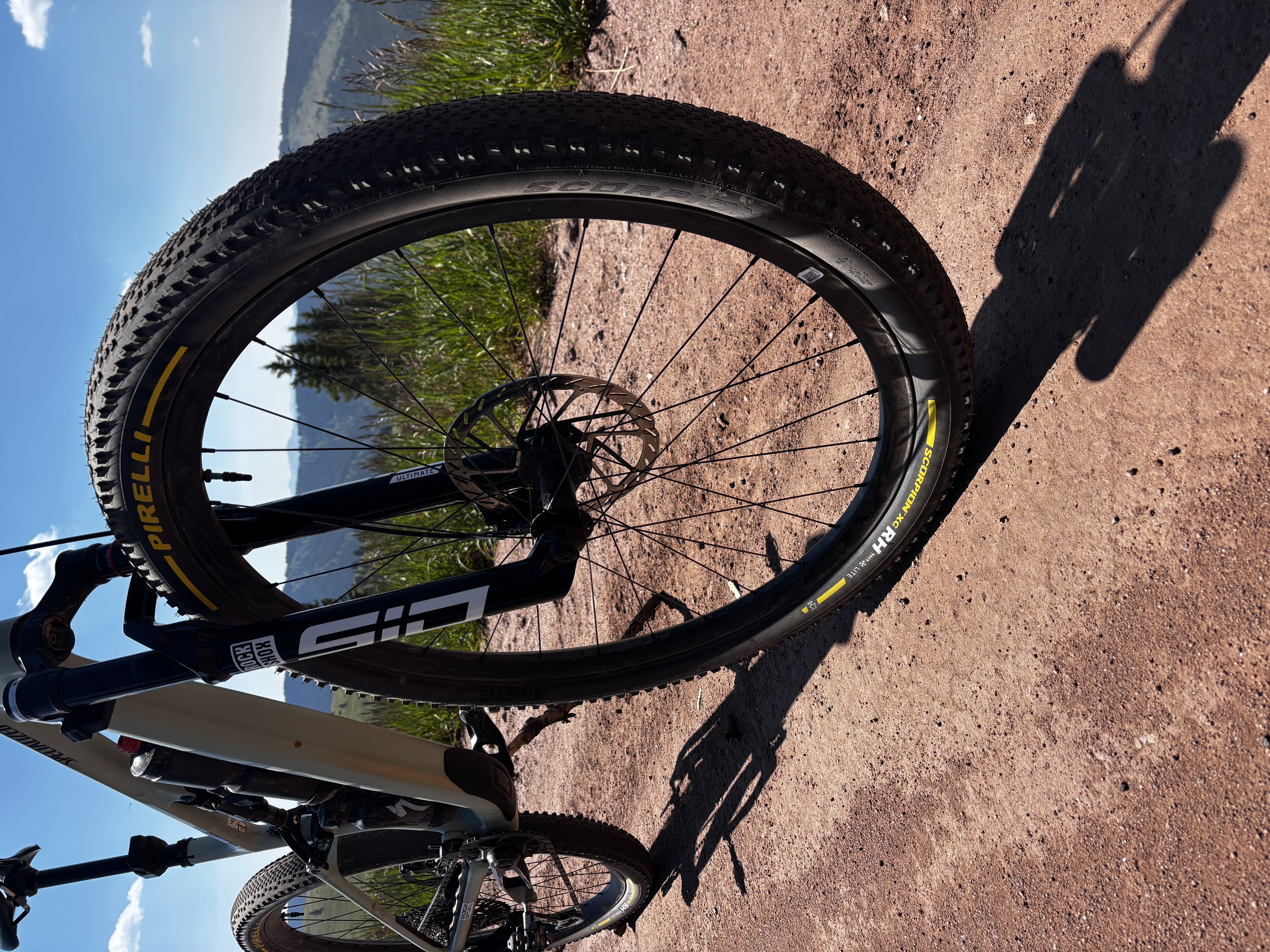 Pirelli Scorpion XC RH Lite mounted on the front of a Specialized Epic 8 with a mountain backdrop