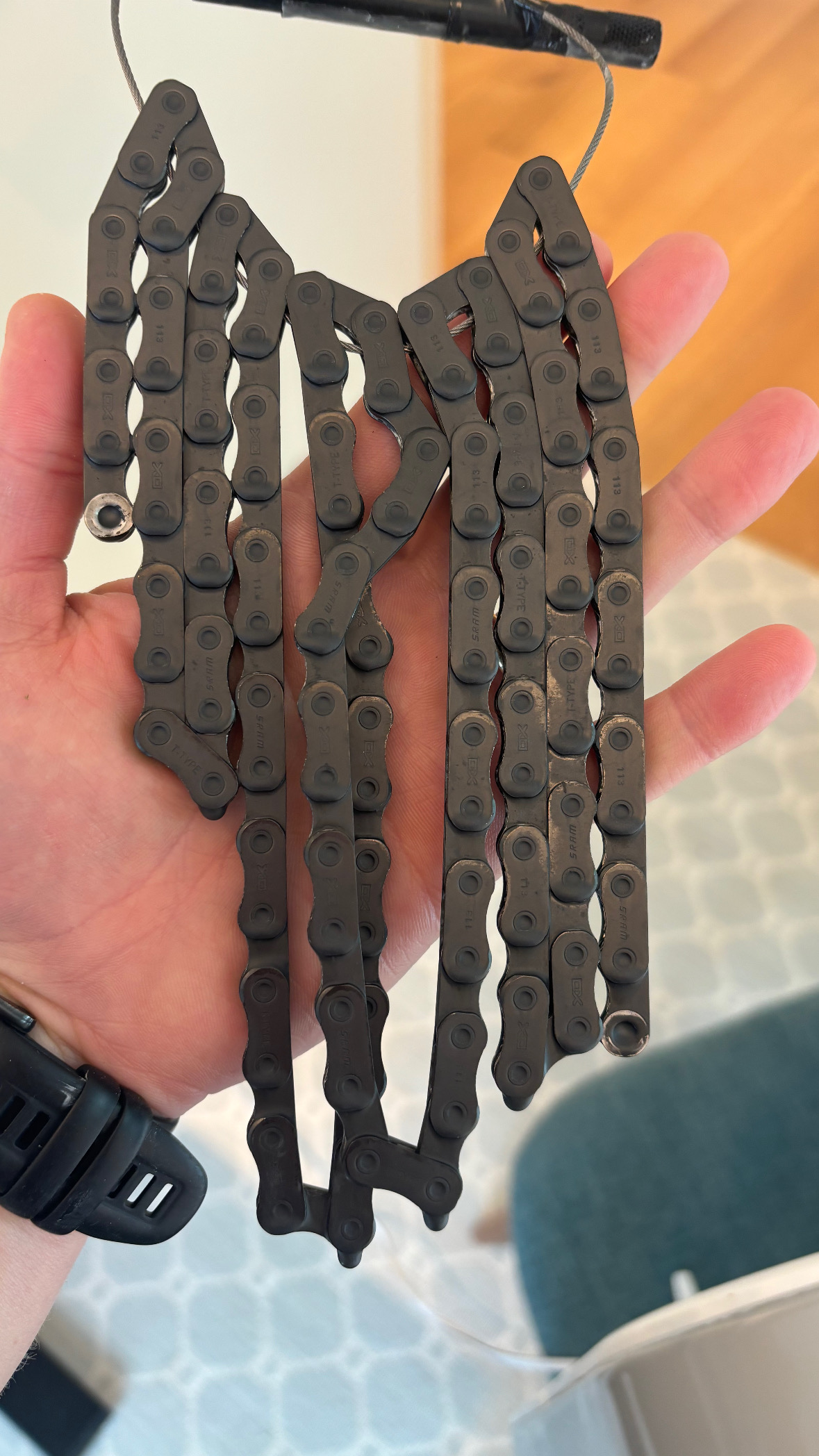 Fully waxed chain in hand before reinstalling