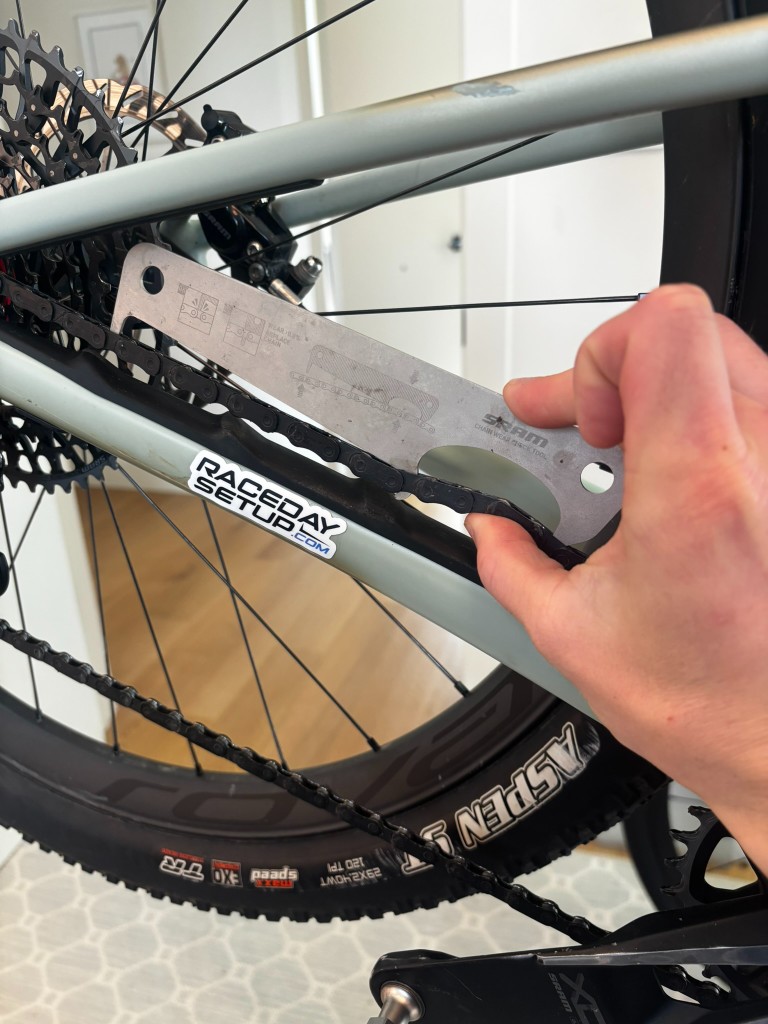 SRAM chain wear indicator tool on a bicycle chain
