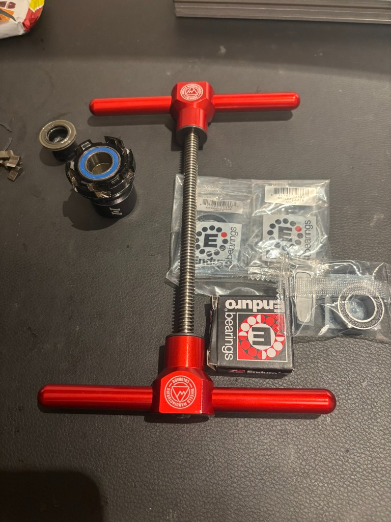 Freehub body, Enduro bearings, and bearing press laid out for hub service